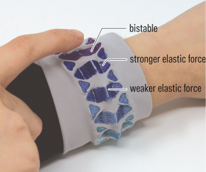 Embrogami: Shape-Changing Textiles with Machine Embroidery
